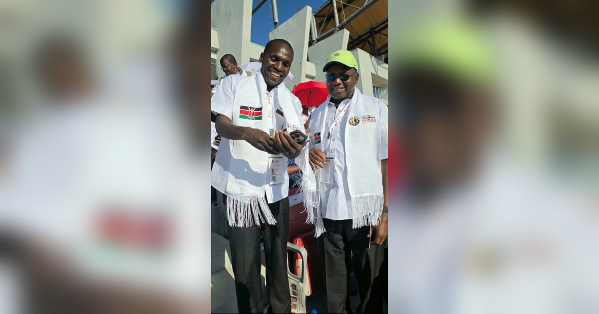 Barnaba Korir and Paul Kipsiele Koech wearing National Heroes Council scarves in the stands at Kipchoge Keino Stadium